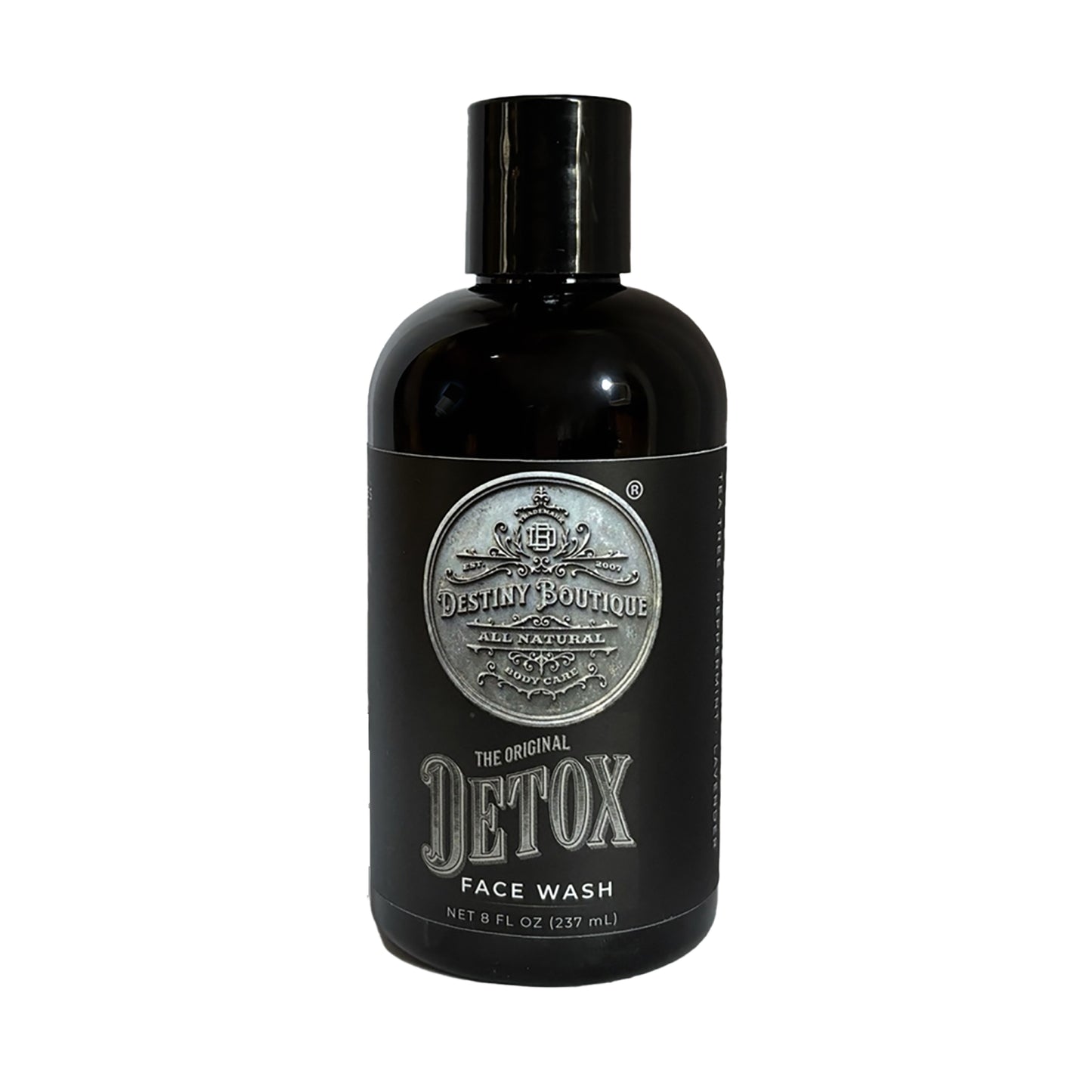 Black bottle of charcoal face wash from Destiny Boutique on a white background