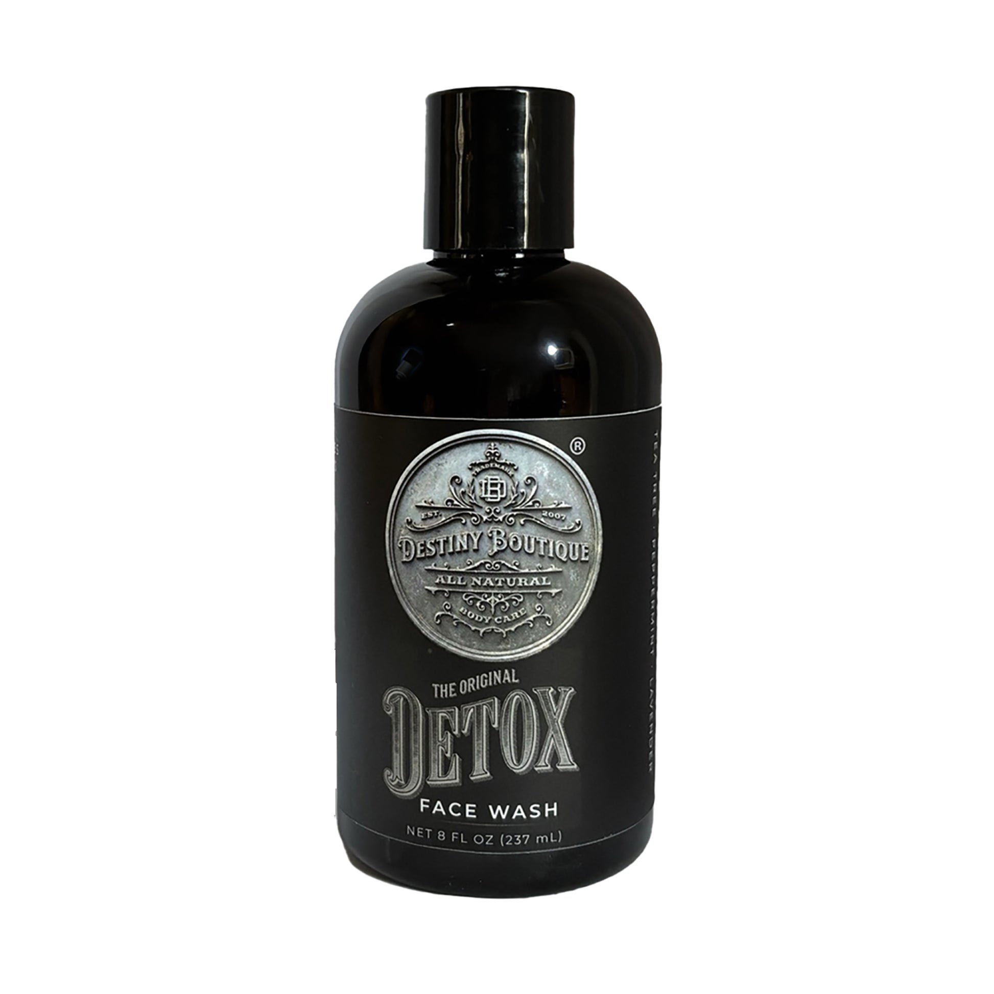 Black bottle of charcoal face wash from Destiny Boutique on a white background